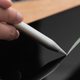 The Adonit Neo Pro stylus being used to write on an Apple iPad tablet.